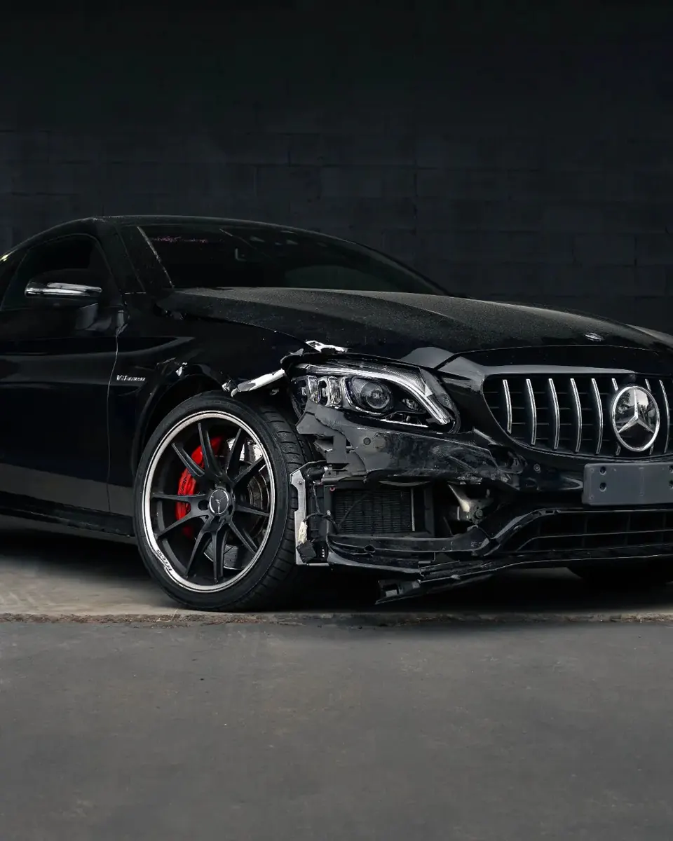 Damaged Mercedes at Diverse Autobody before collision repair